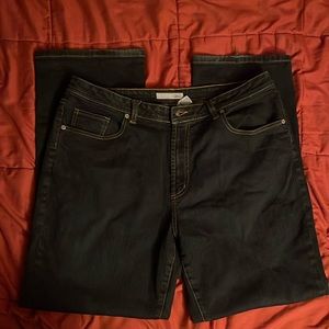 These jeans are Chicos, size 3 and a dark wash.